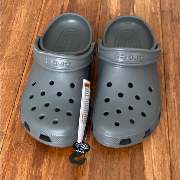 CROCS Shoes - Grey classic Crocs. NWT. Sz 8 Women’s/Sz 6 Men’s.